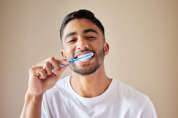 a man brushing his teeth