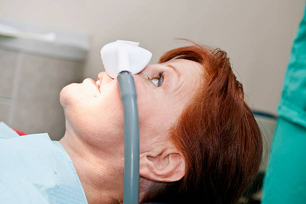 a woman under sedation at the dentist's